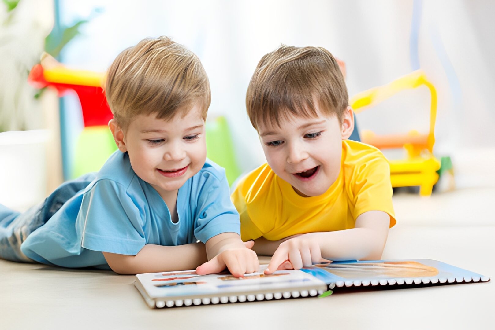 Happy boys with picture book