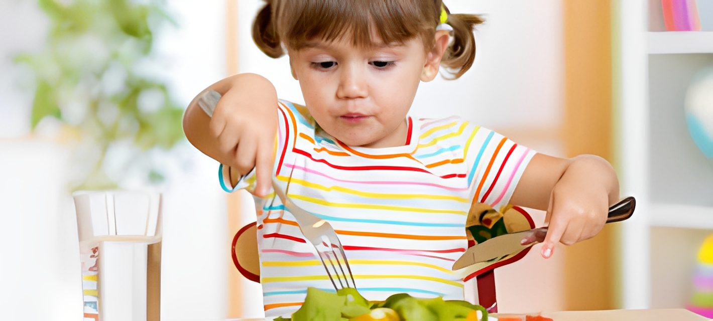 Little girl enjoying healthy meal