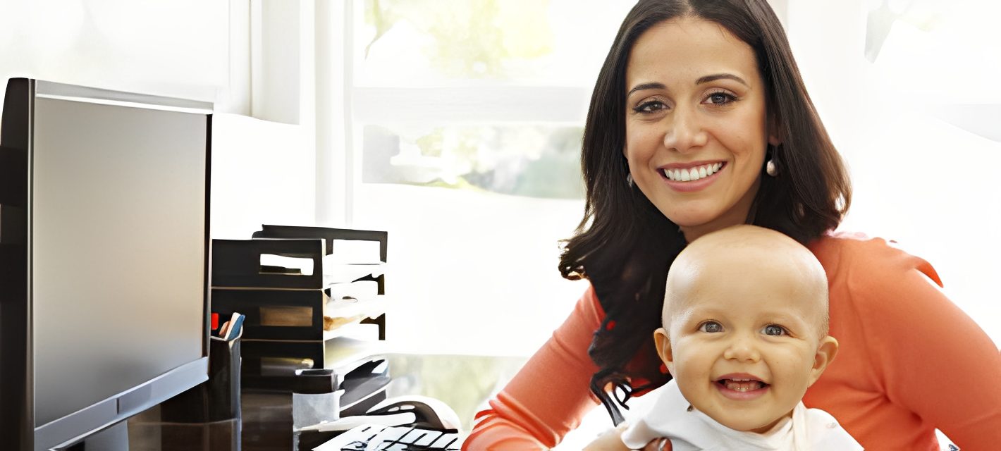 Woman working from home with baby