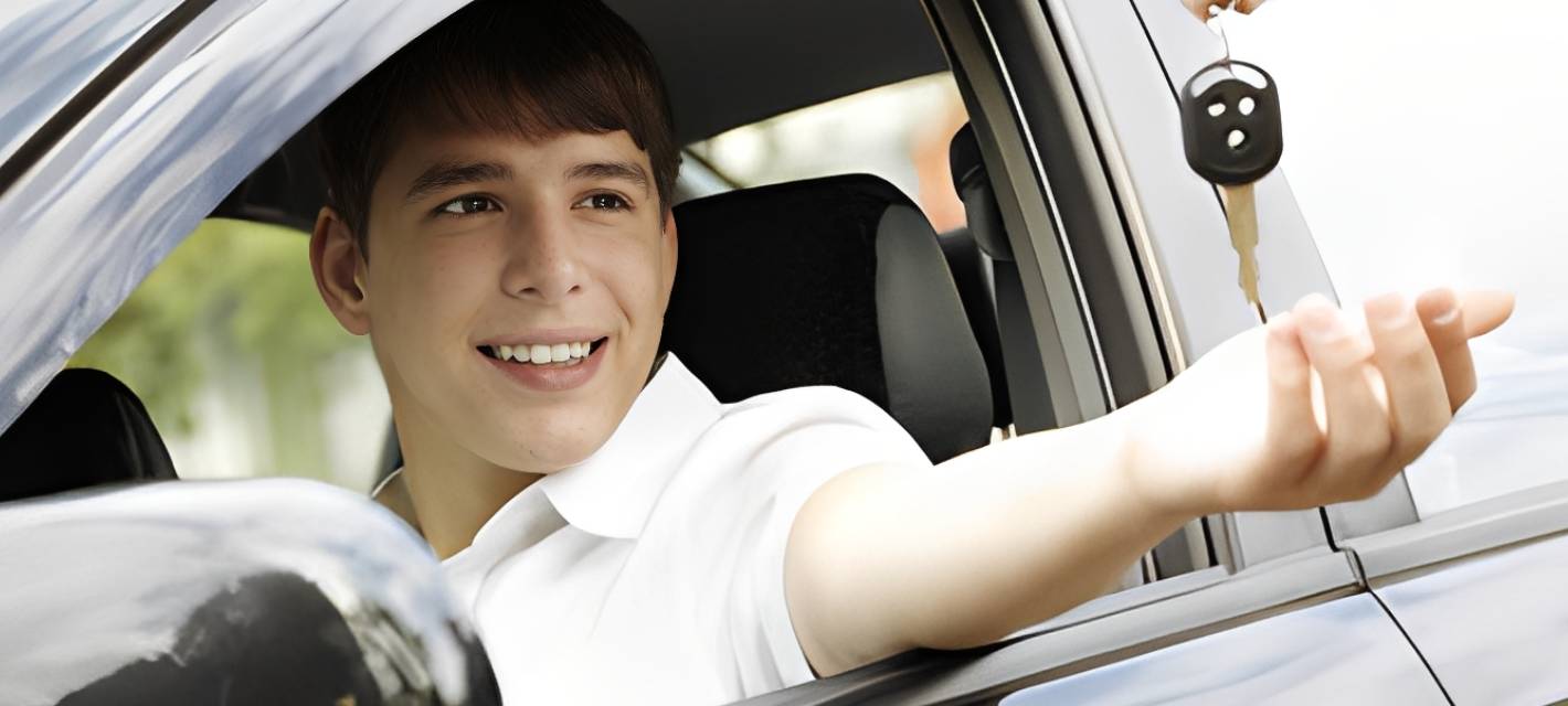 Happy person in car with keys