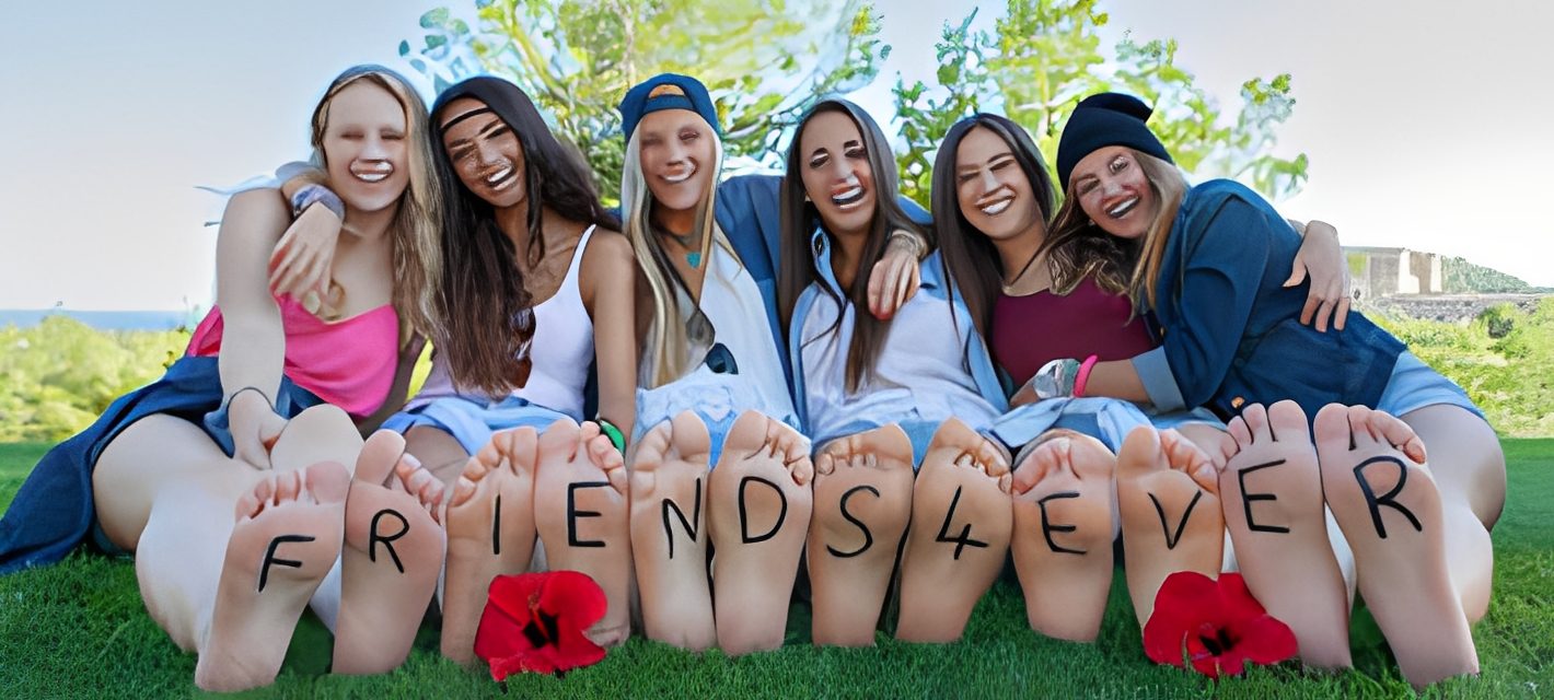 Group of friends sitting on grass